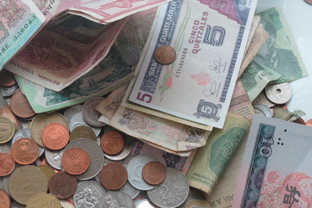 Mixed currency from Europe, especially Euro coins, and other countries such as Hungary, Serbia, Indiaの写真素材