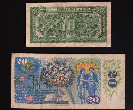 banknotes from former Czechoslovakia - now withdrawn - 10 CSK from the 1950s (denomination written in Slovak) and 20 CSK from the 1980sのeditorial素材