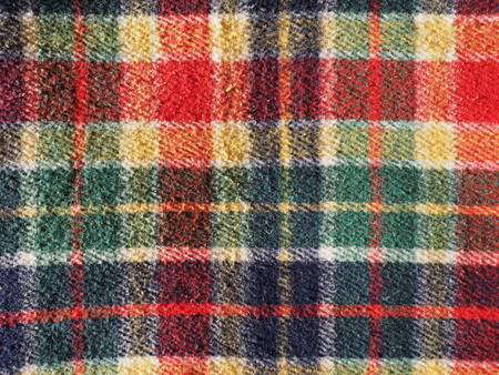 Red green blue and yellow tartan fabric useful as a backgroundの写真素材