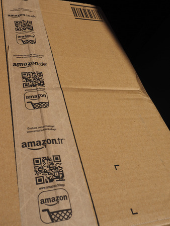 LONDON, UK - CIRCA JANUARY 2016: Brown corrugated cardboard with Amazon logo on adhesive tapeのeditorial素材