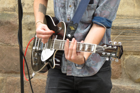 YORK, UK - CIRCA AUGUST 2015: rock band King No-one performing on a street of the city centre -...