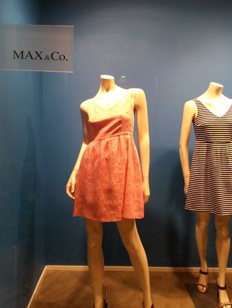 MILAN, ITALY - CIRCA MAY 2014: stylish fashion shop in the city centre displaying high couture clothes, for which Italy is famous worldwideのeditorial素材