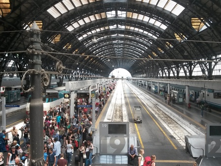 MILAN, ITALY - CIRCA JULY 2014: Milano Centrale, Main railway station in Milan with trains and passengersのeditorial素材