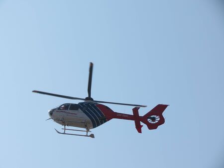 PRAGUE, CZECH REPUBLIC - CIRCA MARCH 2012: Helicopter flying high in the blue skyのeditorial素材