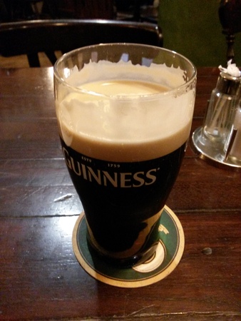 DUBLIN, IRELAND - CIRCA OCTOBER 2015: A pint of Guinness (aka Black stuff)のeditorial素材
