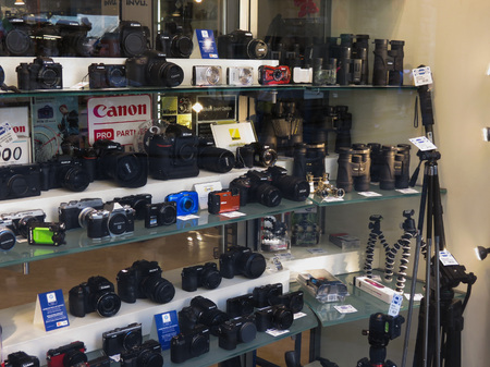 FLORENCE, ITALY - CIRCA JULY 2016: cameras and binoculars on display for saleのeditorial素材