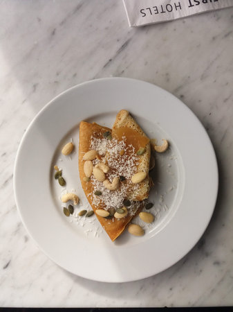 STOCKHOLM, SWEDEN - CIRCA JUNE 2016: Crepe with almonds, cashew nuts, grated coconut and pumpkin seeds served for breakfast at First Hotelsのeditorial素材