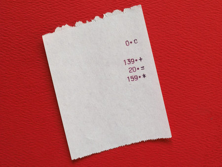 bill or receipt over bright red paper background
