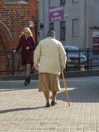 KAUNAS, LITHUANIA - CIRCA APRIL 2017: unidentified old lady in in the city centreのeditorial素材