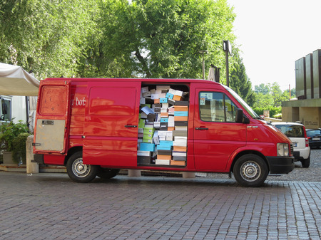 BERGAMO, ITALY - CIRCA JULY 2017: Volkwagen LT van filled with shoes boxes at the market squareのeditorial素材