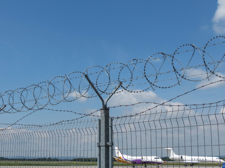 OSTRAVA, CZECH REPUBLIC - CIRCA JULY 2017: barbed wire fence of at the airportのeditorial素材