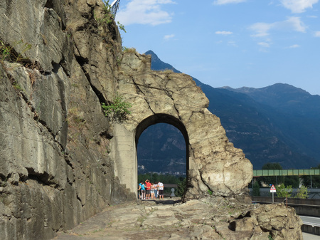 DONNAS, ITALY - CIRCA AUGUST 2017: Ancient roman consular road stone arch with tourists taking a group photoのeditorial素材