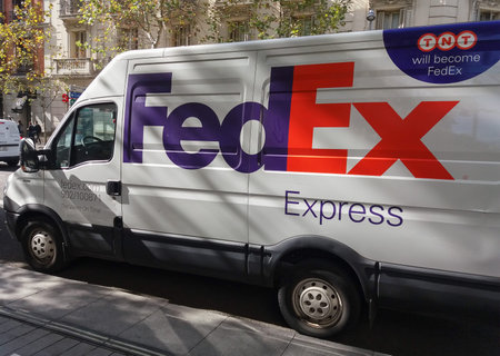 MADRID, SPAIN - CIRCA OCTOBER 2017: white FedEx Express van parked on the street for delivering
