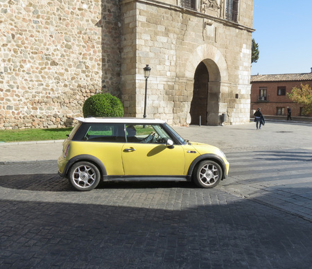 TOLEDO, SPAIN - CIRCA OCTOBER 2017: yellow Mini Cooper car with white roofのeditorial素材