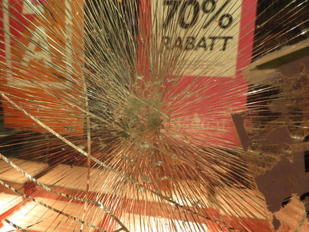 Smashed window glass useful as risk or danger concept