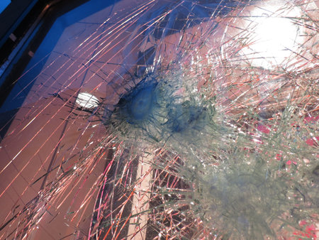 Smashed window glass useful as risk or danger concept