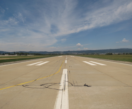 airport runway perspective useful as a travel or holiday conceptの写真素材