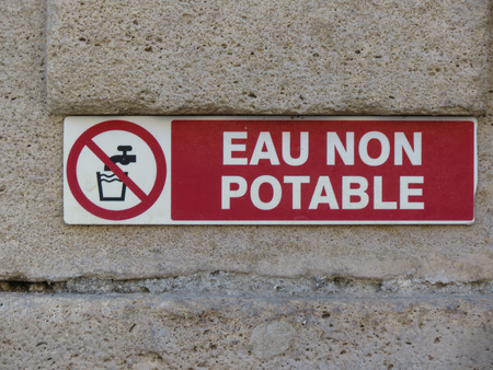 eau non potable (meaning Not drinkable water) warning sign written in French languageの写真素材