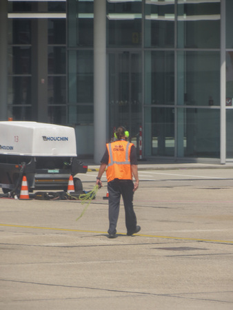 BRATISLAVA, SLOVAKIA - CIRCA JULY 2018: airport personnel on the runwayのeditorial素材