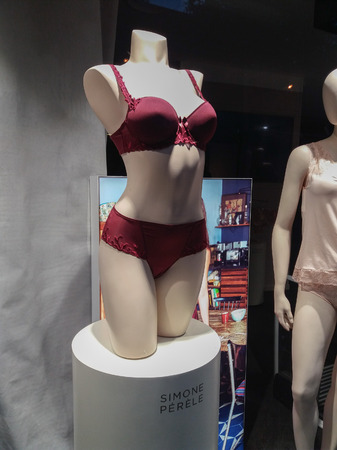 NARBONNE, FRANCE - CIRCA AUGUST 2018: Simone Perele dark red full cup bra and matching French knickers female lingerie underwear for women on a mannequinのeditorial素材