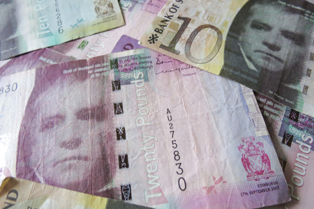 EDINBURGH, SCOTLAND, UK - CIRCA AUGUST 2015: Scottish sterling pound banknotes, currency of Scotlandのeditorial素材