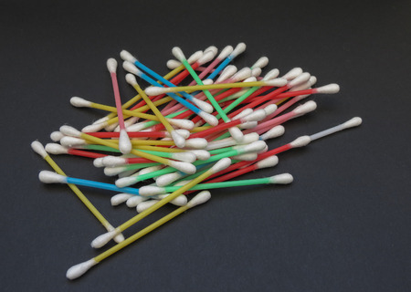 cotton swabs for auricular hygiene over black backgroundの写真素材
