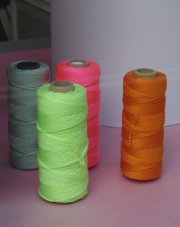 detail view of colour sewing wire threads