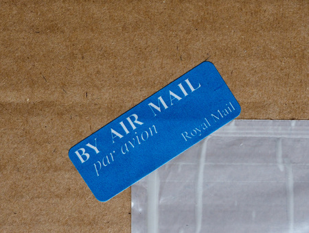 LONDON, UK - CIRCA AUGUST 2017: by air mail - par avion tag by the Royal Mail international mail tag written in English and Frenchのeditorial素材
