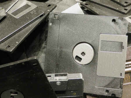 AMSTERDAM, NETHERLANDS - CIRCA APRIL 2013: Magnetic floppy discs and a TDK tape cassette for analog...