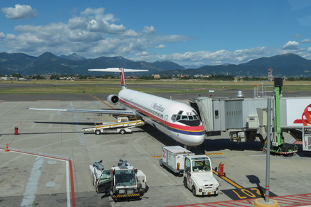 ORIO AL SERIO, BERGAMO, ITALY - CIRCA SEPTEMBER 2015: Mediriana aircraft parked at the airport ready for boarding via a tunnel bridgeのeditorial素材