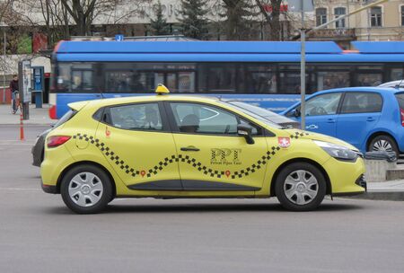 VILNIUS, LITHUANIA - CIRCA APRIL 2017: yellow PPT taxi cabのeditorial素材