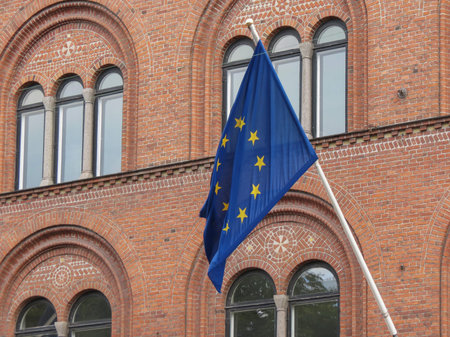 facade of the main railway station in Helsingor, Denmark, with EU flag