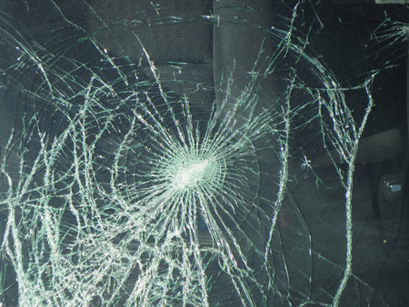 Smashed window glass useful as risk or danger concept