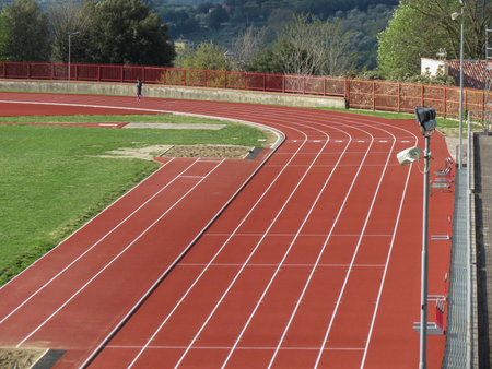 All-weather running track perspective useful as sport or competition concept
