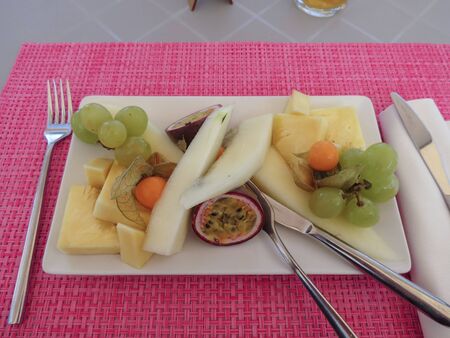 CAGLIARI, ITALY - CIRCA OCTOBER 2019: fruit salad in a white rectangular dishのeditorial素材