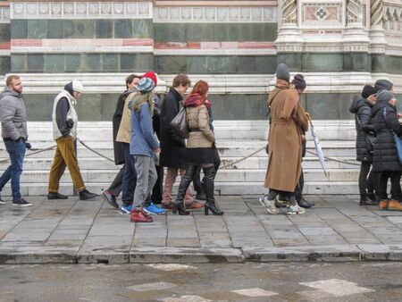 FLORENCE, ITALY - CIRCA NOVEMBER 2019: people queuing to enter the cathedralのeditorial素材