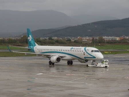 FLORENCE, ITALY - CIRCA NOVEMBER 2019: AirDolomiti Embraer ERJ-195LR during taxi at Peretola airport in Florenceのeditorial素材