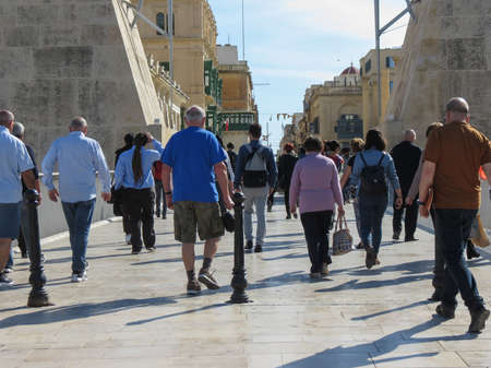 VALLETTA, MALTA - CIRCA MAY 2019: crowd of people at the main gate of the old townのeditorial素材