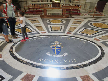 VATICAN CITY, ROME, VATICAN CITY STATE - CIRCA OCTOBER 2018: John Paul II marble stone in St Peter basilica with his motto " Totus tuus " (translated "All yours ")のeditorial素材