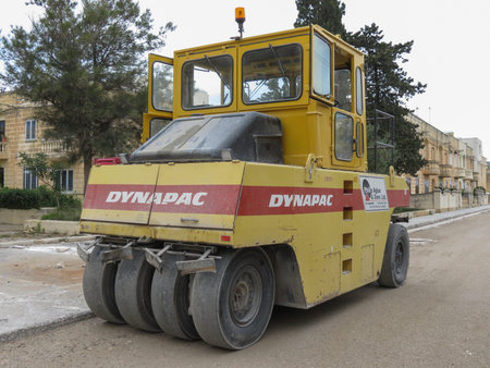 VALLETTA, MALTA - CIRCA MAY 2019: pneumatic road roller parked in a street with road worksのeditorial素材
