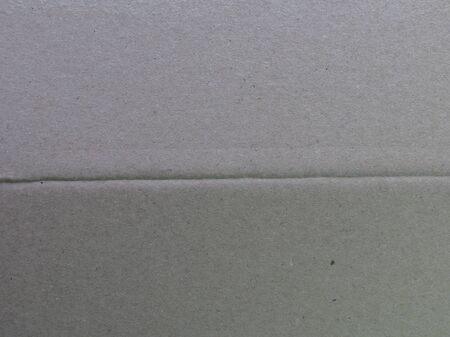 grey paperboard surface useful as a backgroundの写真素材