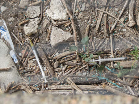 CAGLIARI, ITALY - CIRCA OCTOBER 2019: heroin needles discarded in a parkのeditorial素材