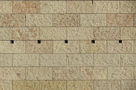 beige stone wall useful as a backgroundの写真素材