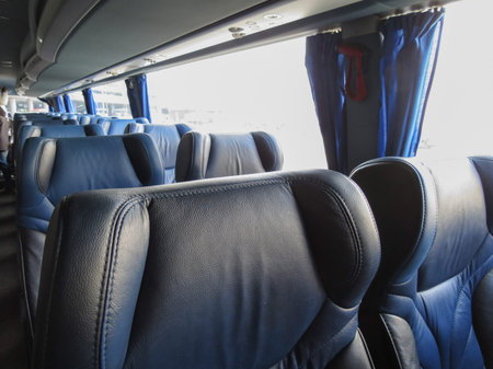 VIENNA SCHWECHAT, AUSTRIA - CIRCA NOVEMBER 2014: interiors of a bus with blue leatherette seatsのeditorial素材