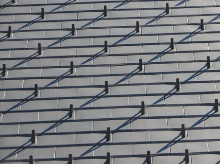 grey steel roof with snow guarding useful as a background