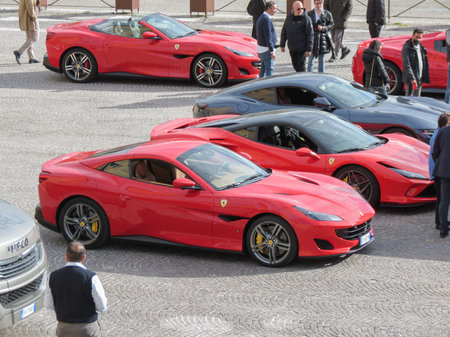 URBINO, ITALY - CIRCA APRIL 2022: Ferrari cars parked in the city centre
