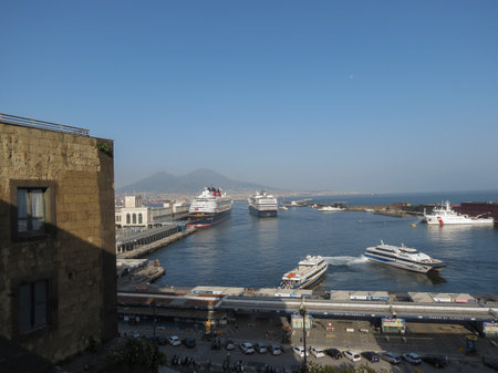 NAPLES, ITALY - CIRCA JUNE 2019: Maritime station with cruise shpis and Vesuvius in the backgroundのeditorial素材