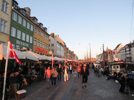COPENHAGEN, DENMARK - CIRCA AUGUST 2017: Nyhavn translation New Harbour 17th century waterfront canal and entertainment district just before sunsetのeditorial素材