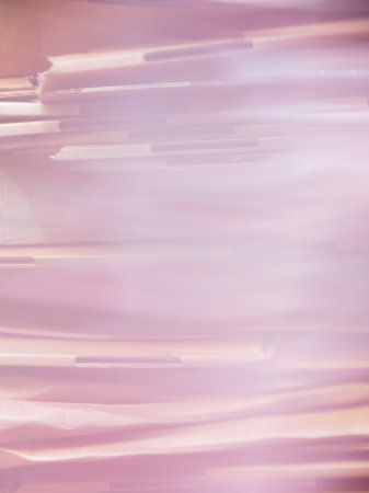 beige corrugated cardboard texture useful as a background - pink blurred toneの写真素材