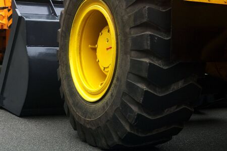 Heavy tractor wheel from ground viewの写真素材